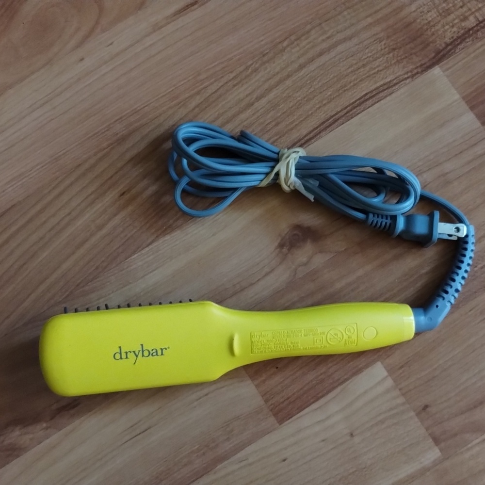 The Drybar Baby Brush Crush Mini Heated Straightening Brush is compact and has a